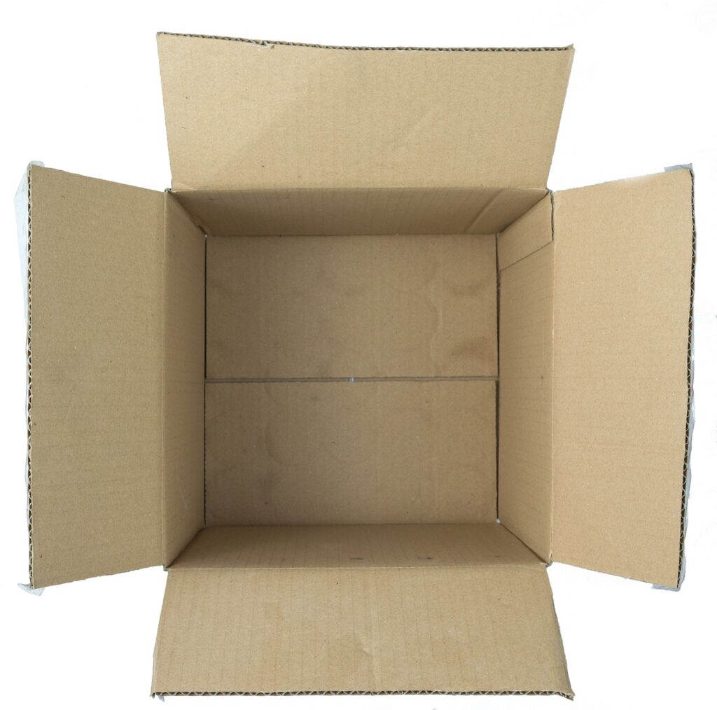 Monkey holding cardboard